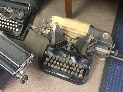 Five vintage typewriters including an early 20th century circa 1900 Oliver typewriter
