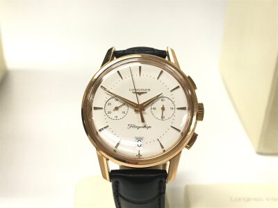 Longines Flagship Heritage 18ct Gold case Black Crocodile leather strap with tang buckle Metallic silver dial
Approx 38mm case. Seen running. Comes with box and some paperwork. 76.42g