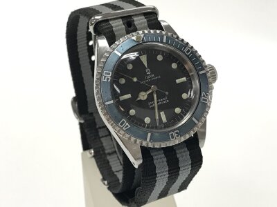 A rare Tudor Oyster Prince submariner reference 7016/0 with the transitional small rose dial and bezel with patina to "ghost bezel" blue/grey. Serial number 6430** which places it in first year of production 1968. Winds and runs. Tritum dots glow but fade quickly indicating they have not been relumed. Current owner had Watch serviced as shown in image.