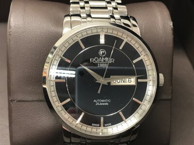 Roamer R-Matic IV automatic watch featuring a black dial and a stainless steel bracelet. Seen running. Boxed.