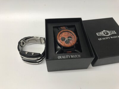 A storm watch working and a bobbird watch with wood insets.