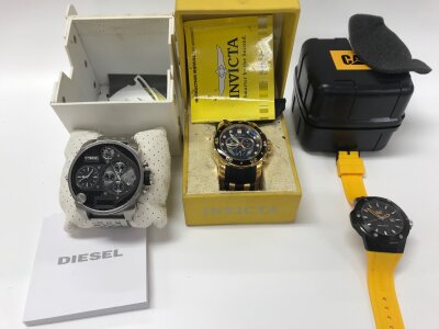 Three fashion watches including Diesel and Cat.