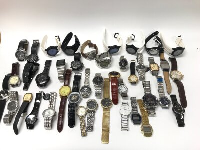A large collection of assorted fashion watches including Rado, Rotary etc