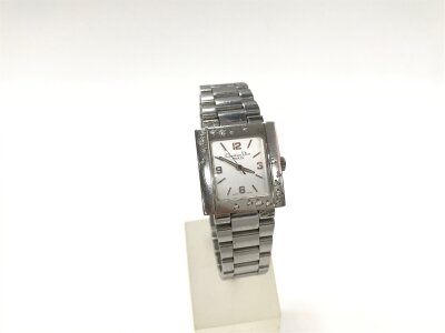 Christian Dior Riva wristwatch features a rectangular stainless steel case and bezel set with diamonds. 24 x 25mm case. 
Seen running.