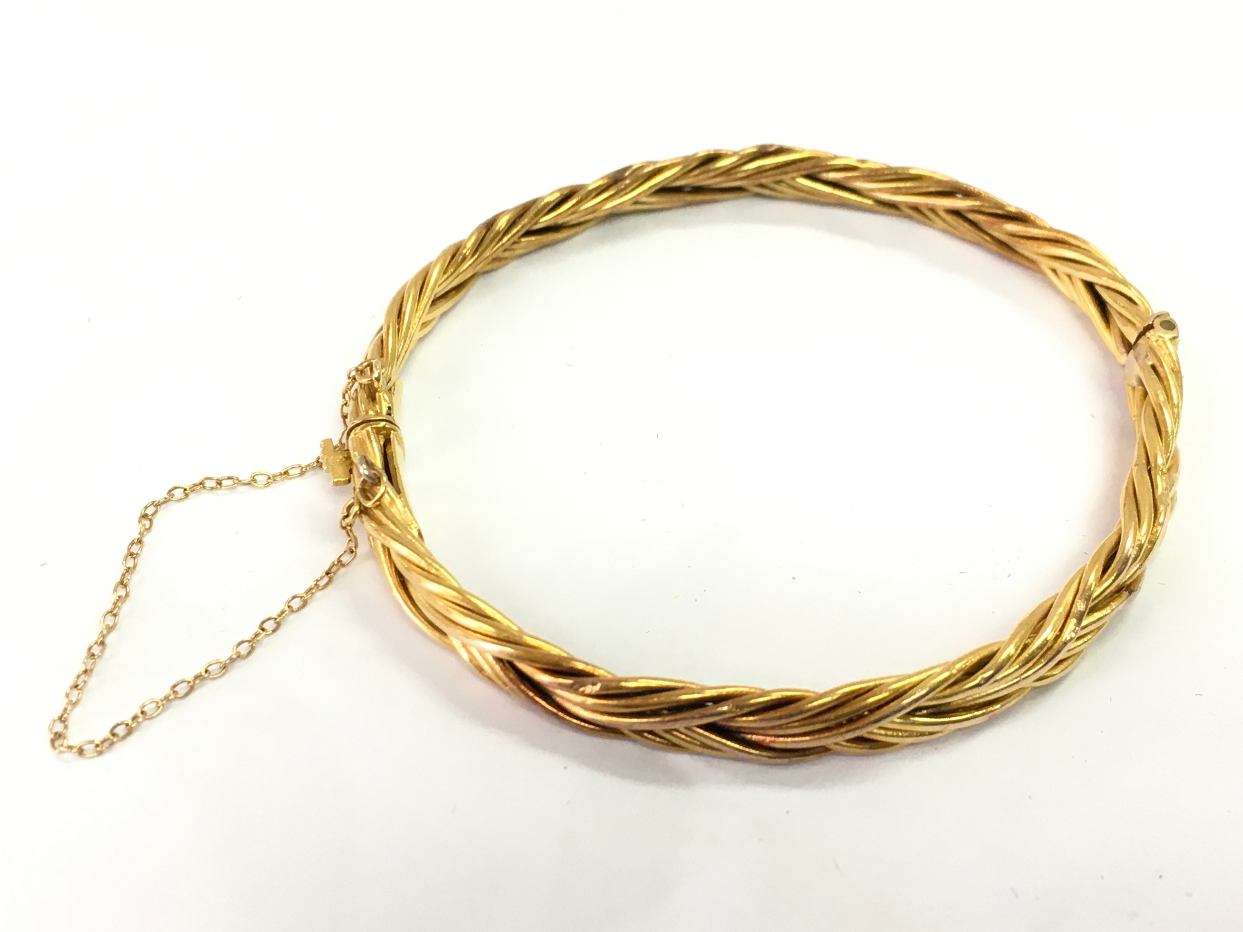 A 15ct gold bangle . 6cm wide. Approximately 12g