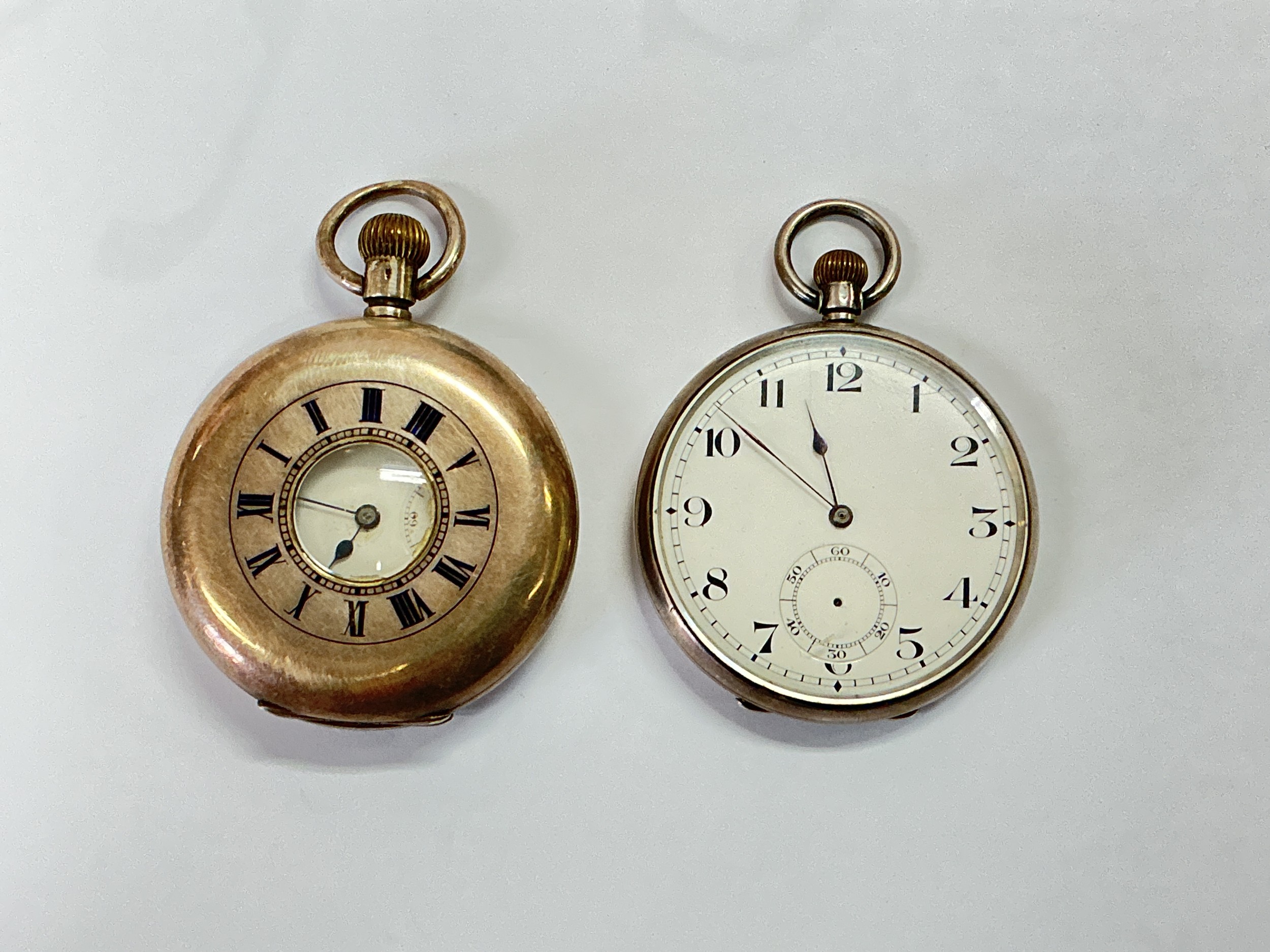 Two silver pocket watches comprising an open faced example and a half hunter with military inscription to the reverse.