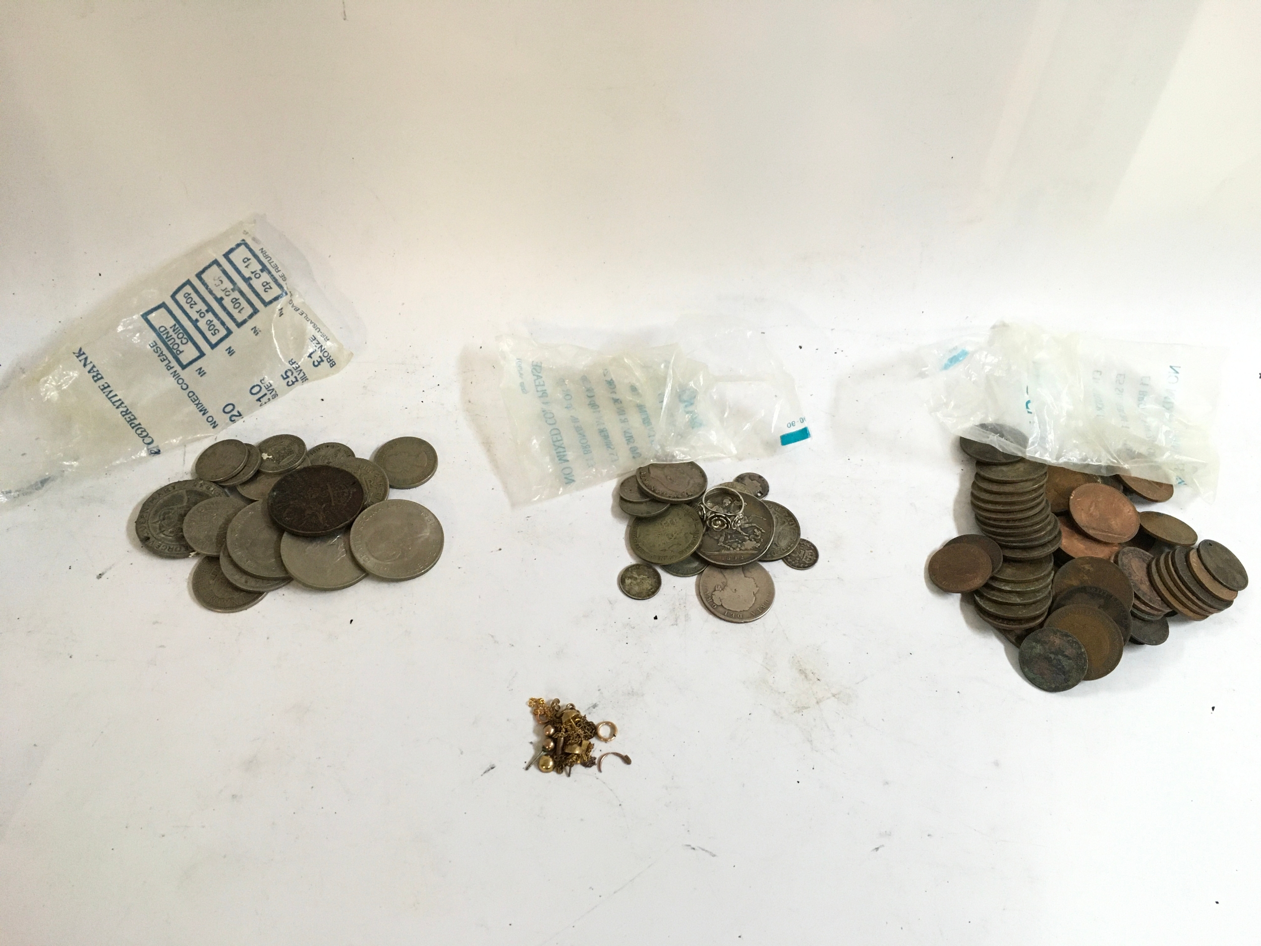 A collection of vintage coinage and some yellow metal condiments   