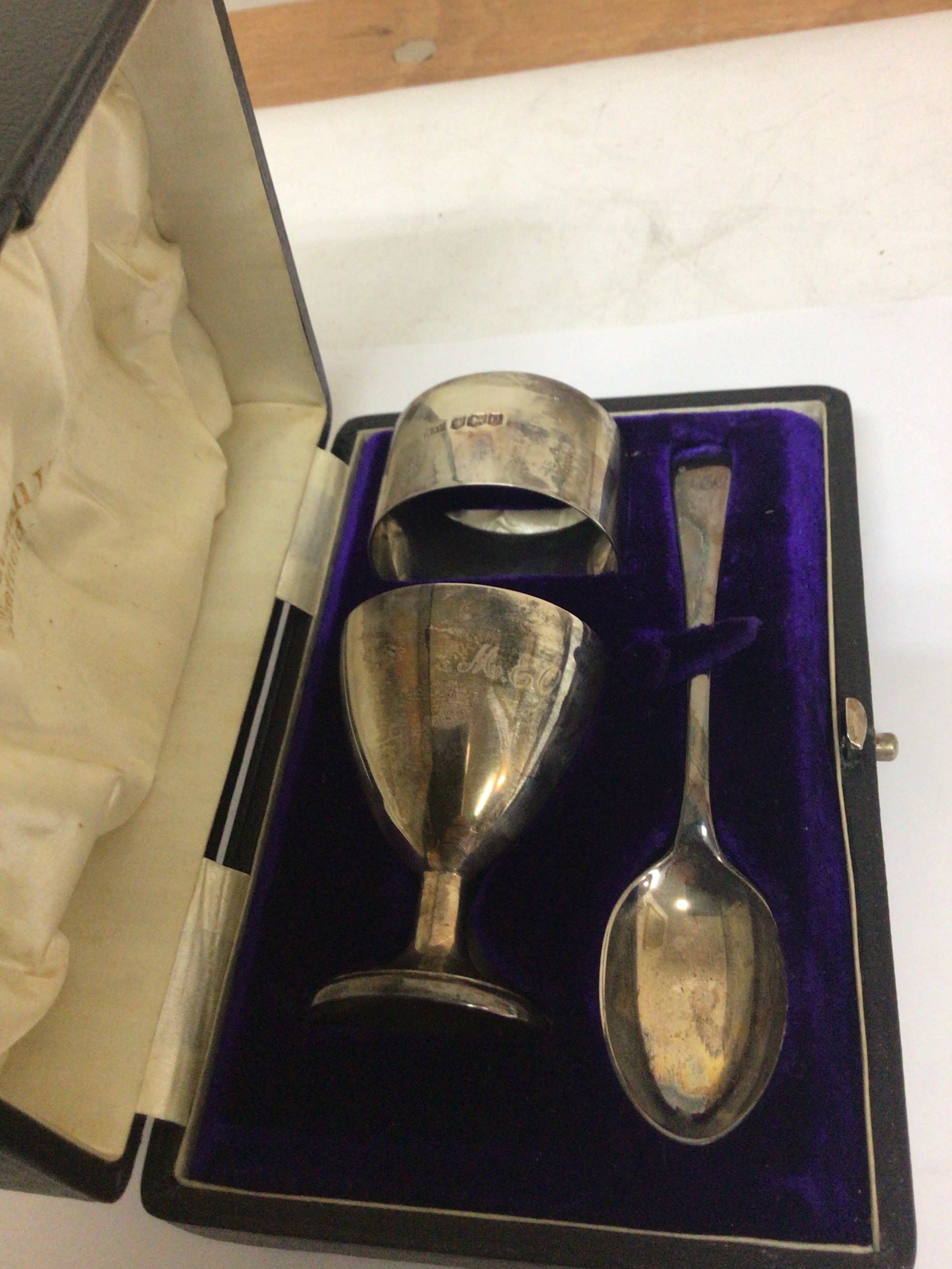  A cased silver christening set with napkin ring egg cup and spoon.  