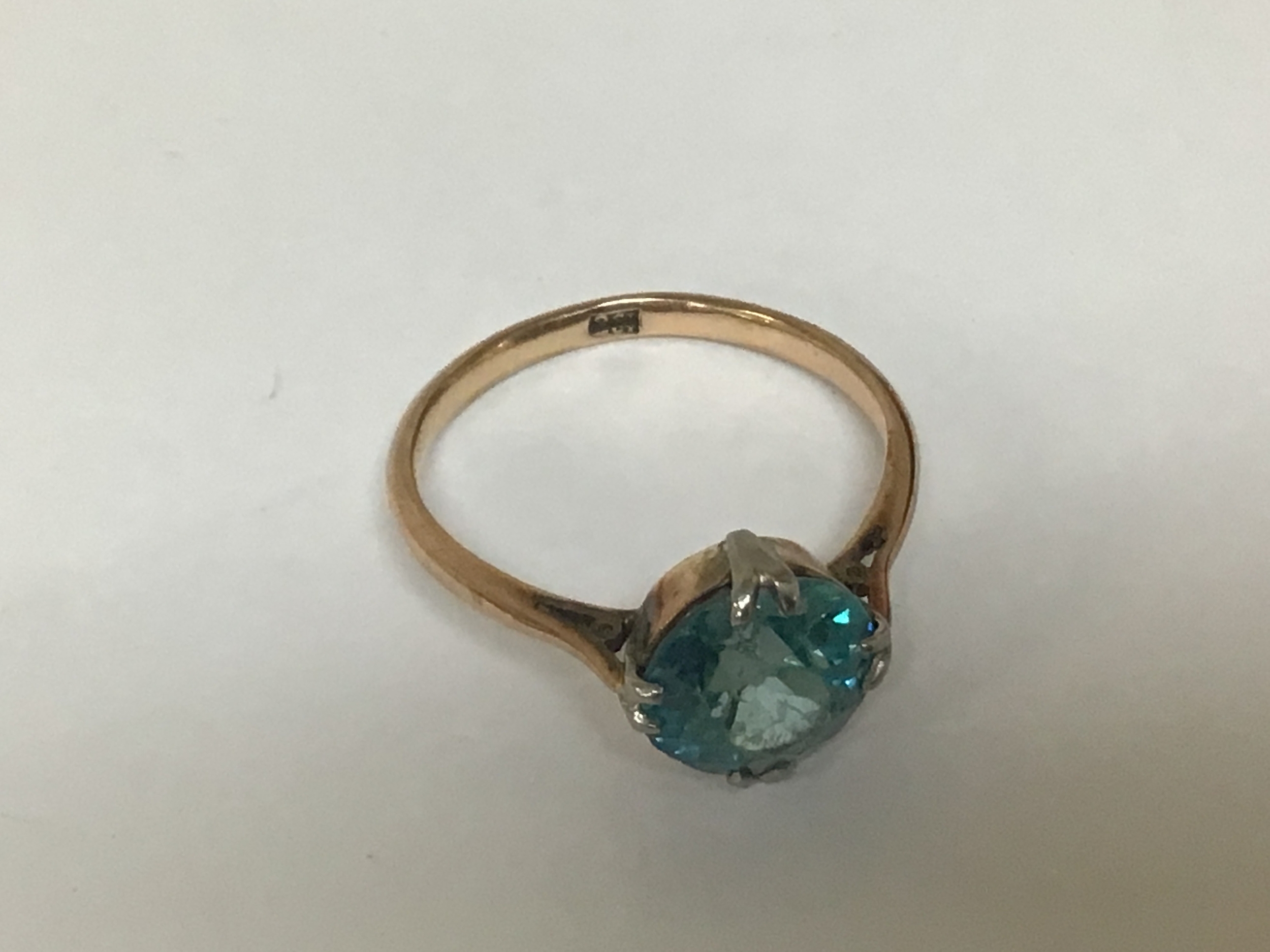 A 9carat gold ring set with a vivid blue Oval cut stone possible a blue Zircon. Weight 2.8g 