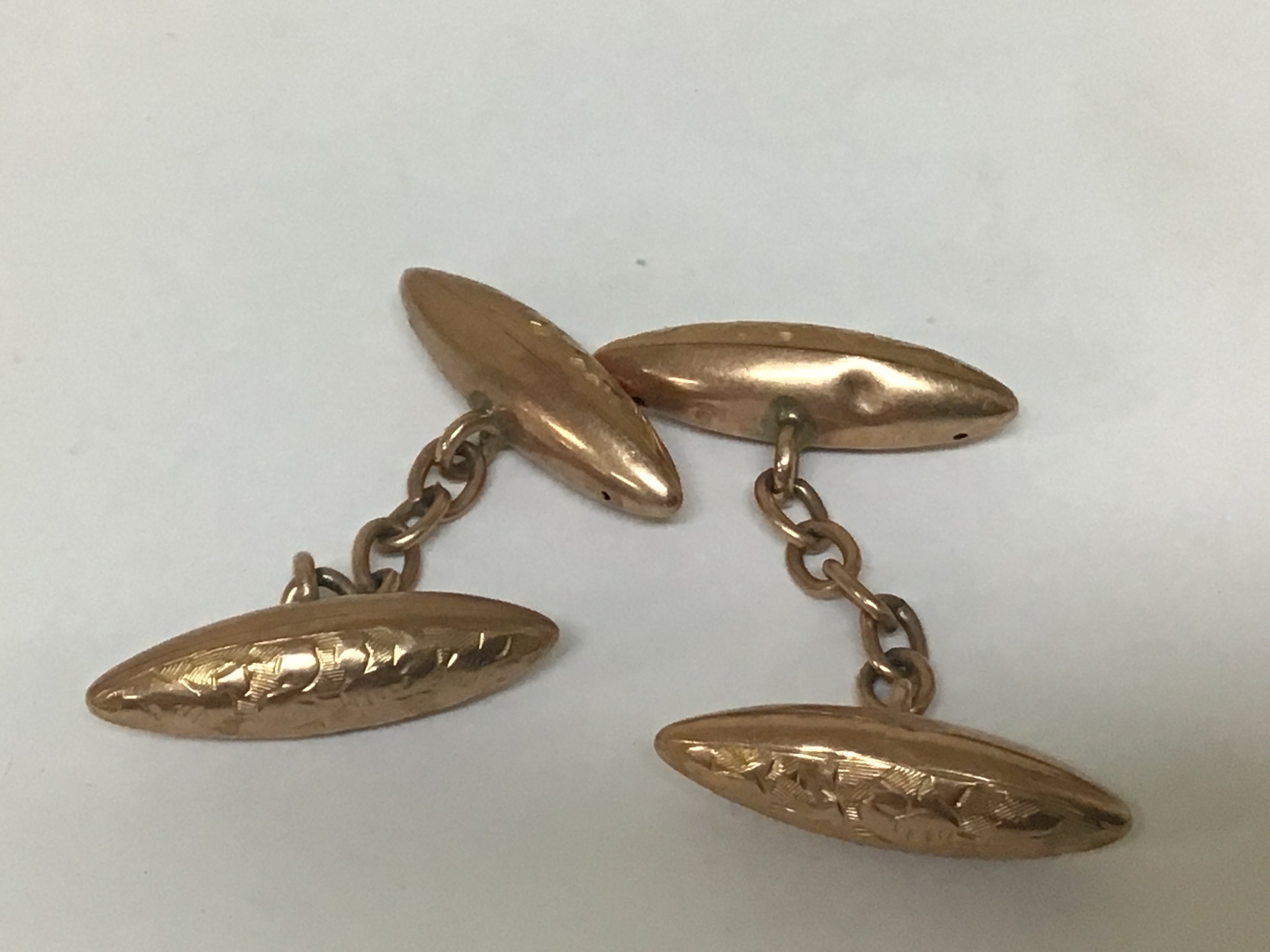  
A Pair of 9carat gold gents cufflinks with engraved decoration 9carat marks with Chester hallmarks weight 3