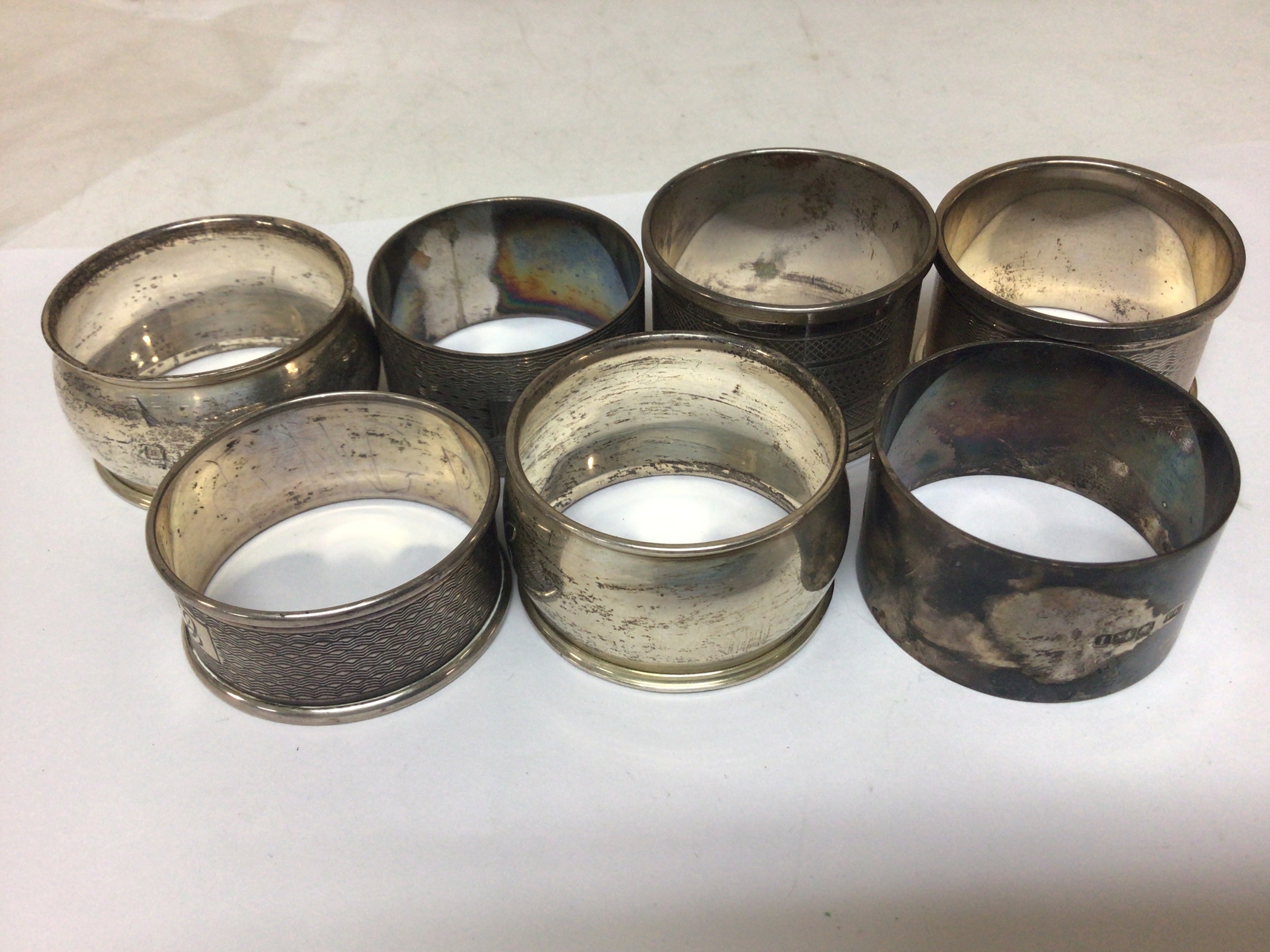 A Collection of silver napkin rings mixed patterns and hallmarks. Weight 140g approximately. 