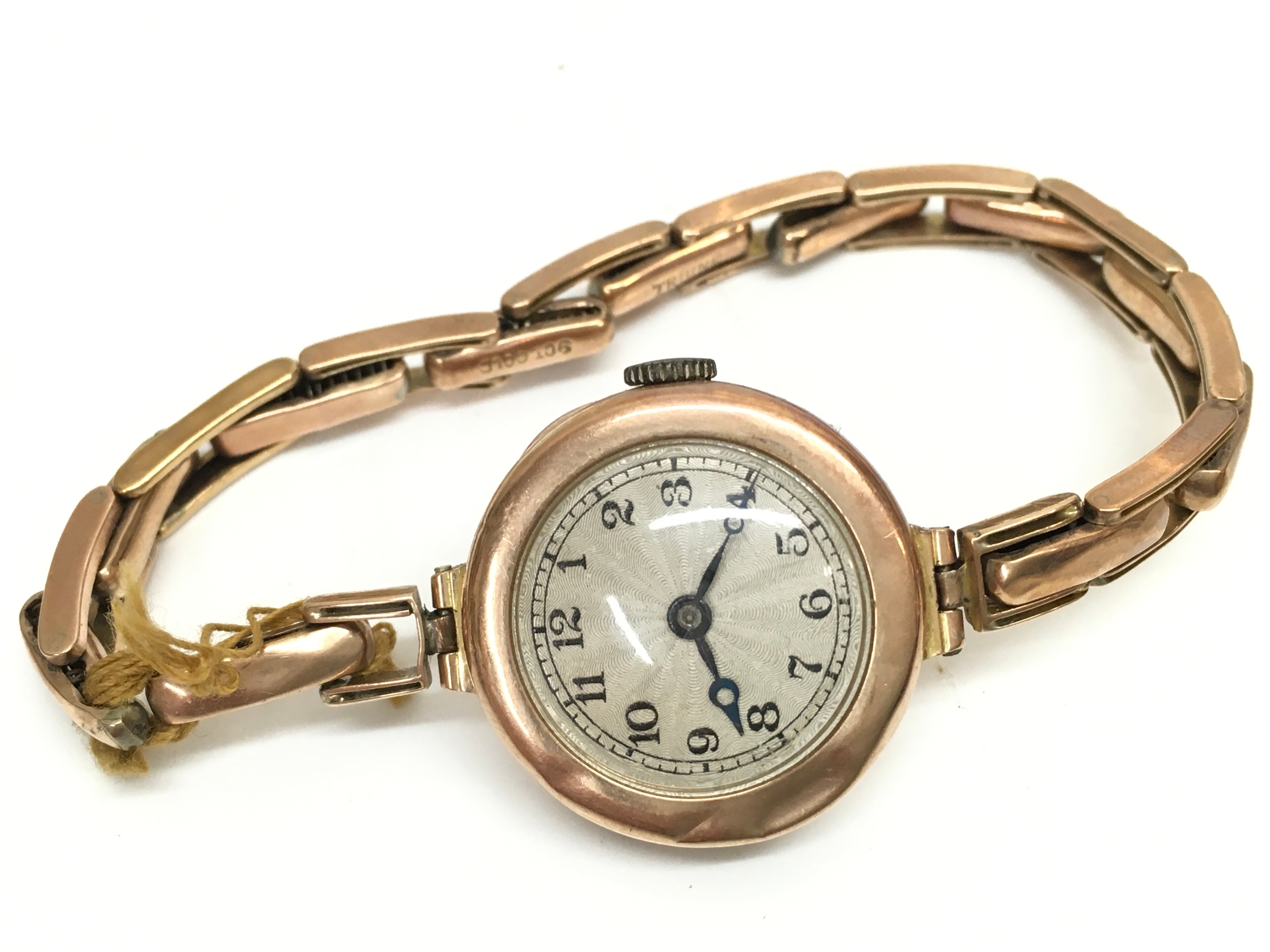 A 9ct gold cased watch and strap. Total weight 21.8g 