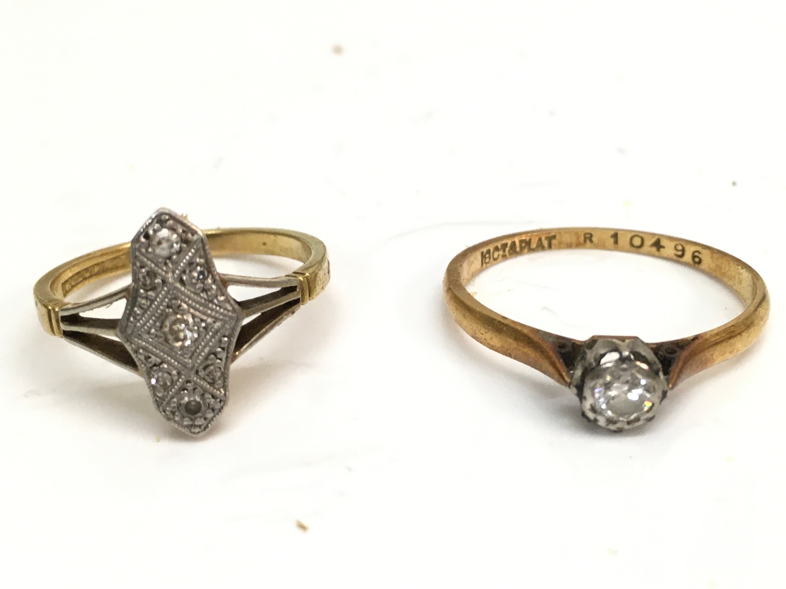 Two 18ct gold and platinum diamond set rings. Total weight 4.6g