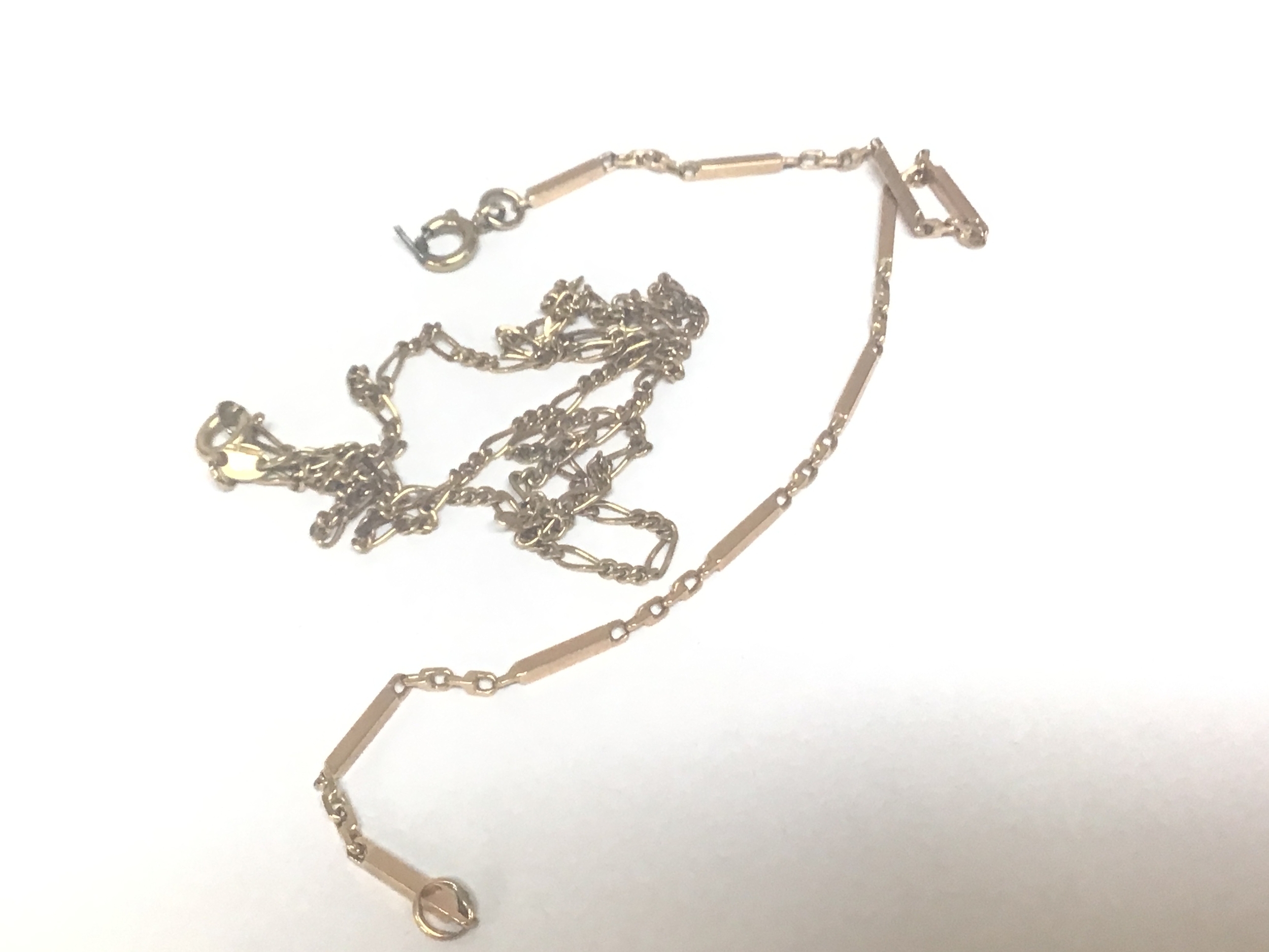  A 9carat gold bar and link bracelet and a 9carat gold chain. Weight 6.5g 