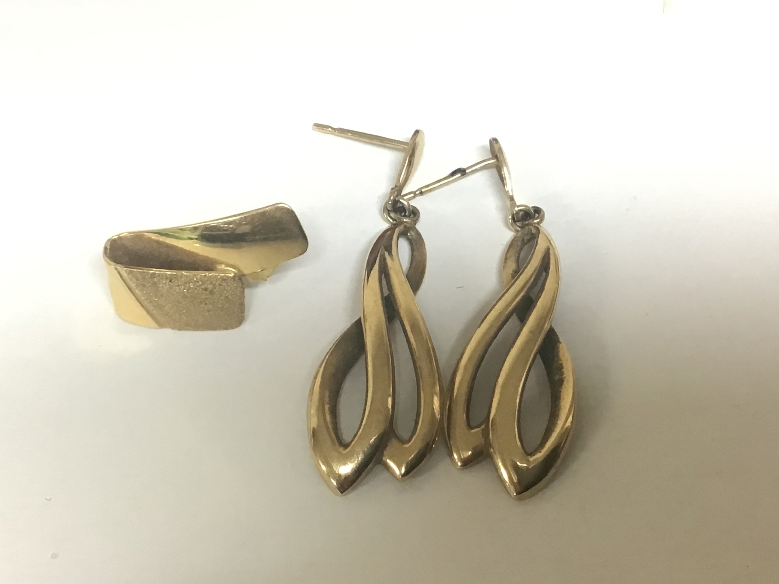 A Collection of earrings including one 18carat gold earring weight 2g a pair of 9 carat gold earrings weight 3.5g and a box of other mixed earrings. 