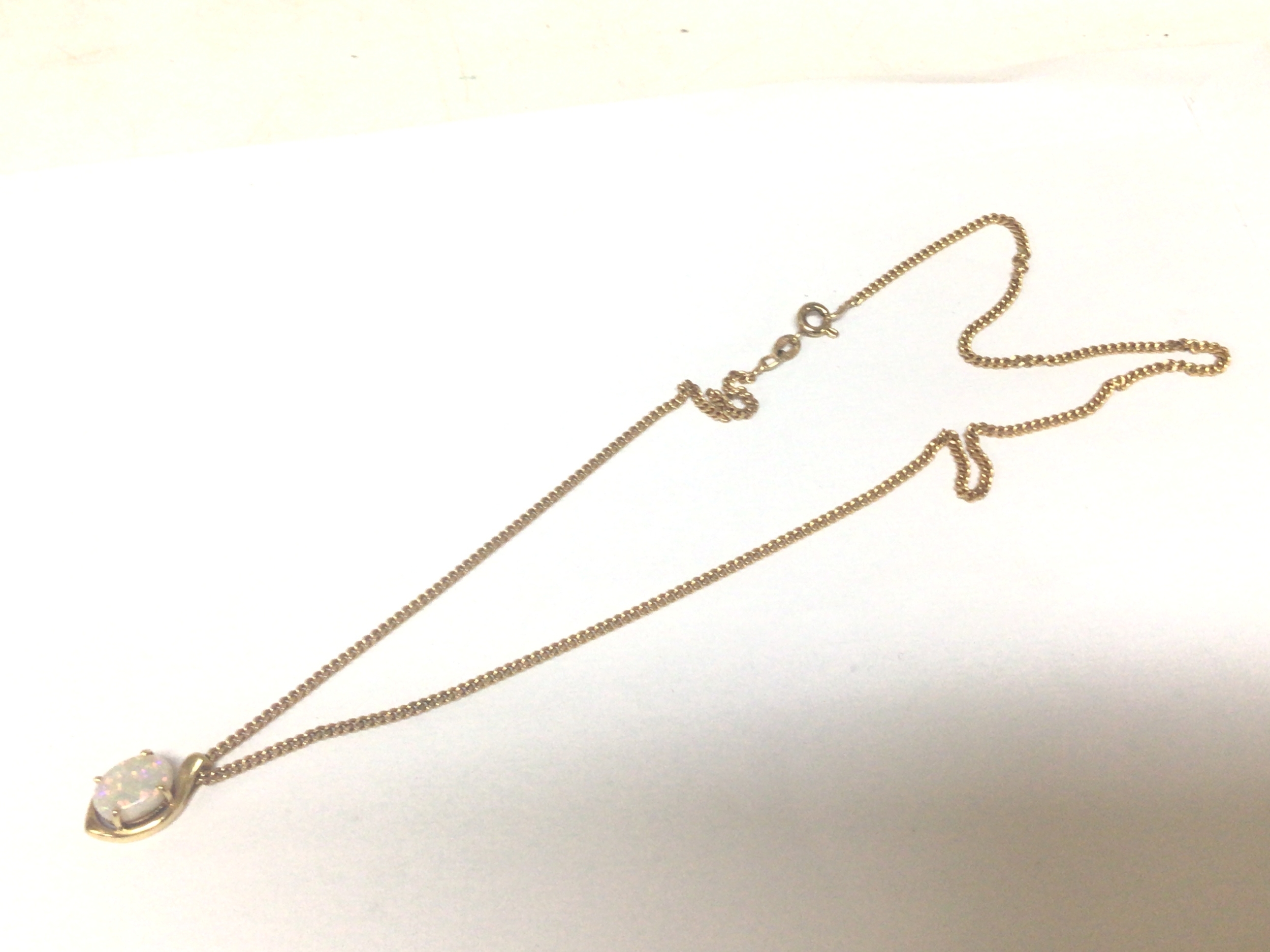 A 9carat gold necklace with attached opal set pendent weight 5g approx.