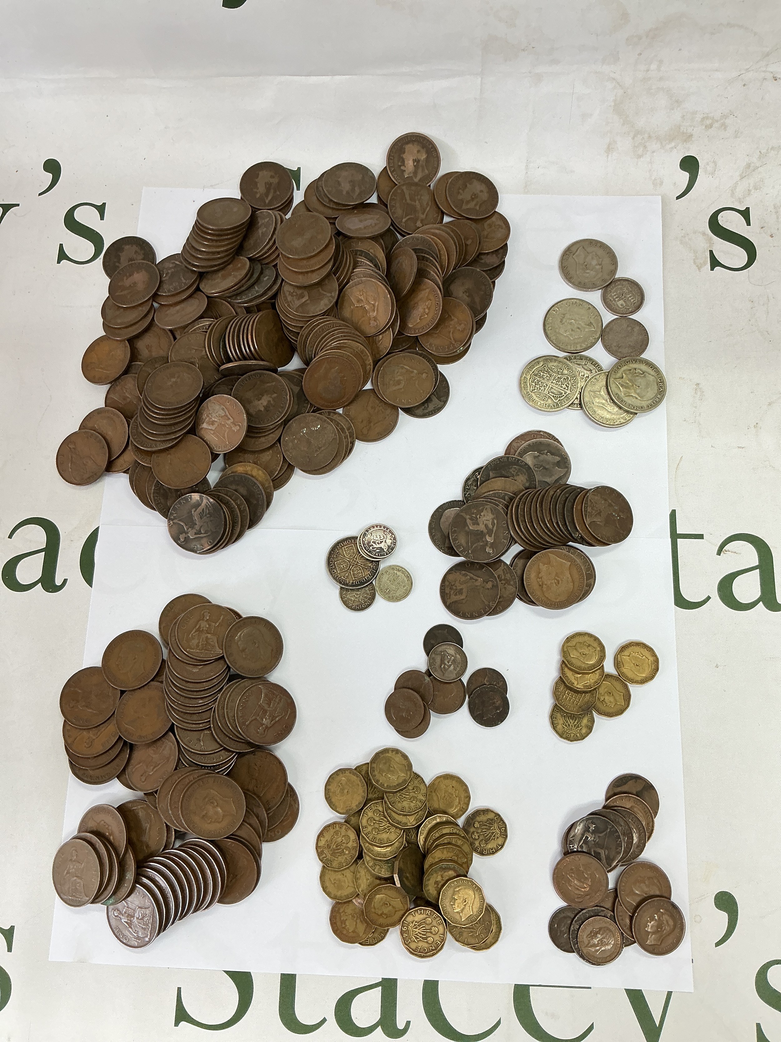 A tin of old GB coinage.