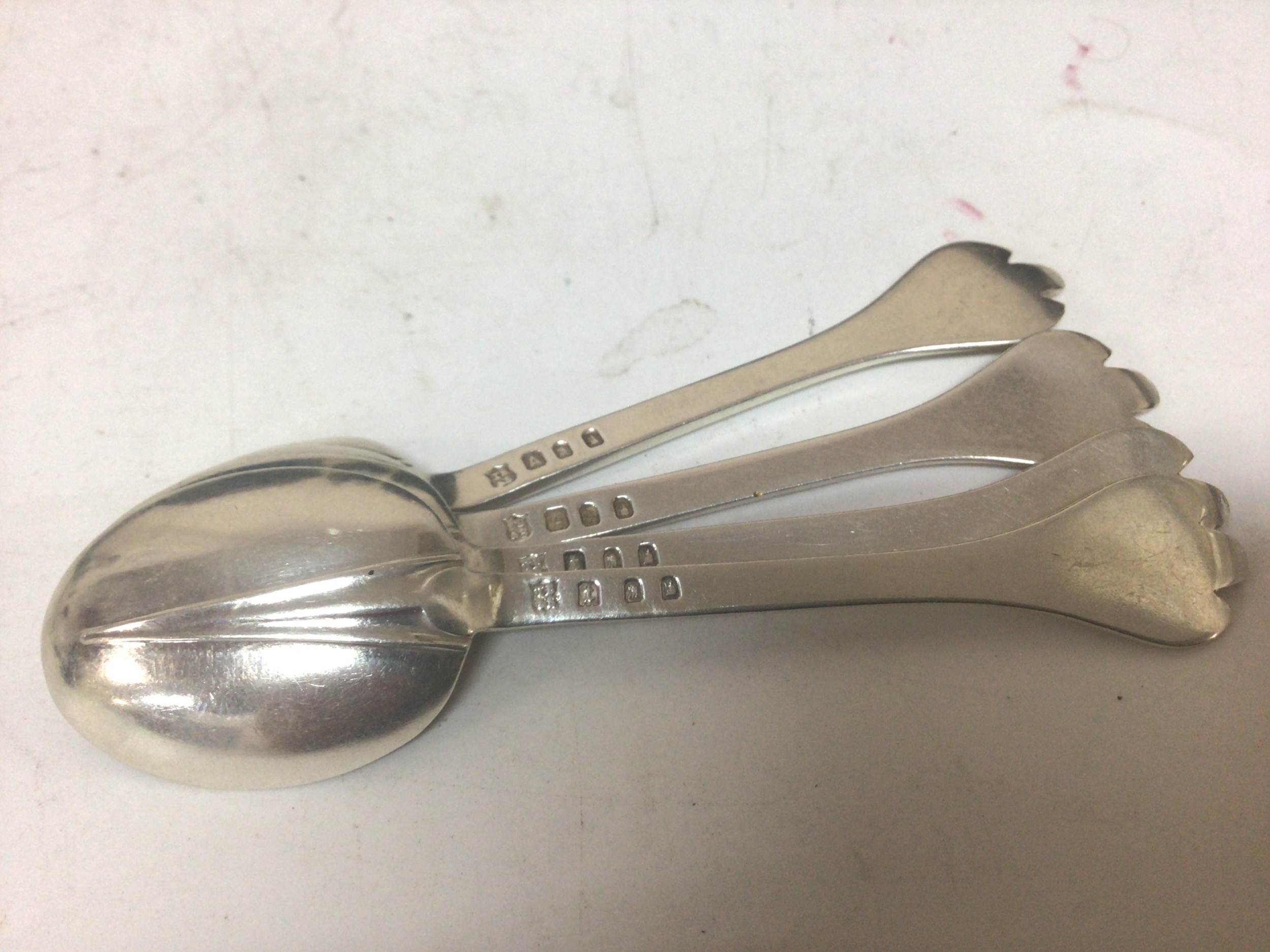 A set of four Scottish Hanoverian silver spoons. Engraved with regimental cypher. Weight 55g Edinburgh hallmarks 