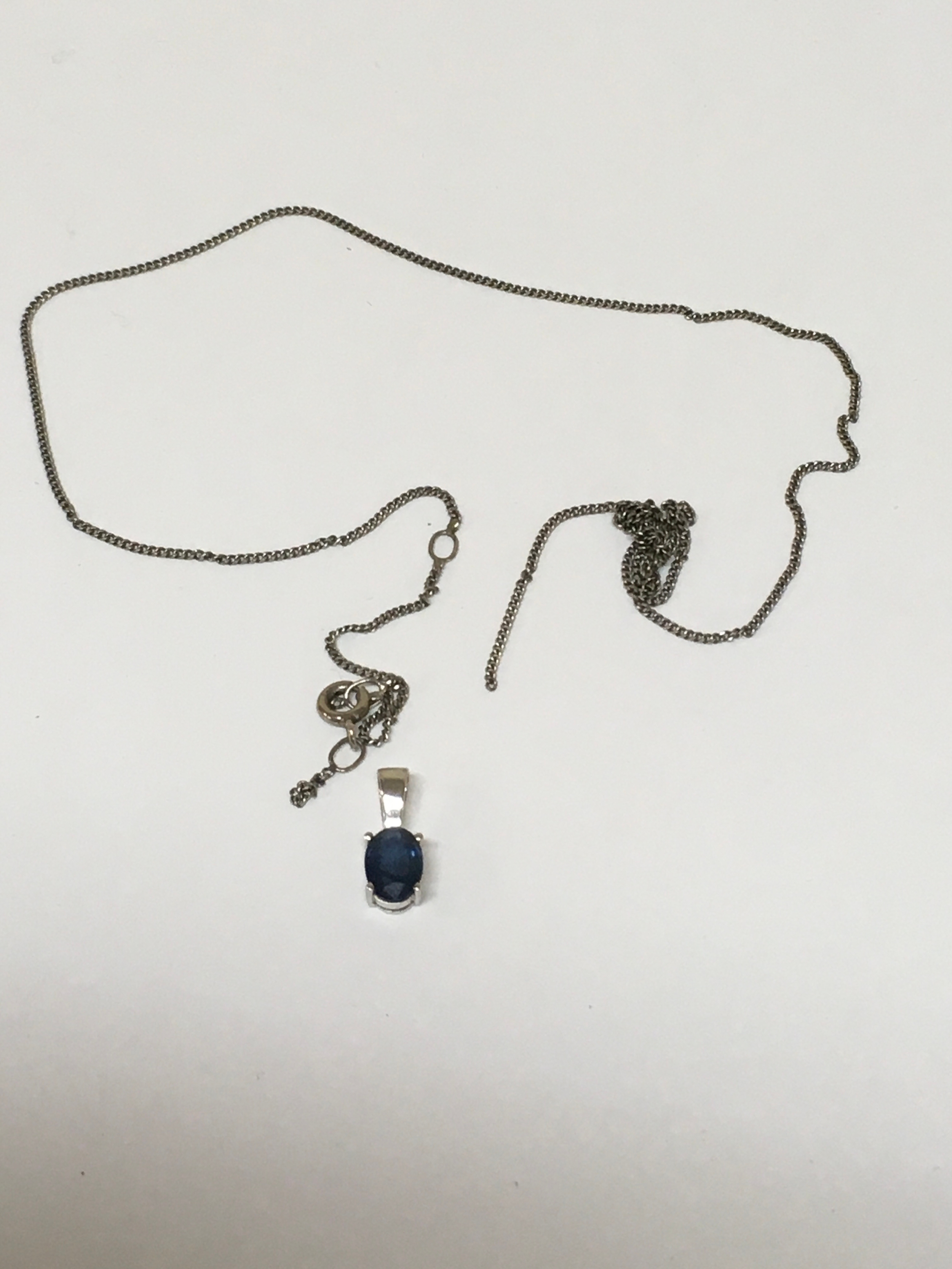 Silver Chain (A/P) Carat  White Gold pendant with inset Sapphire. Includes The Diamond Store London box.