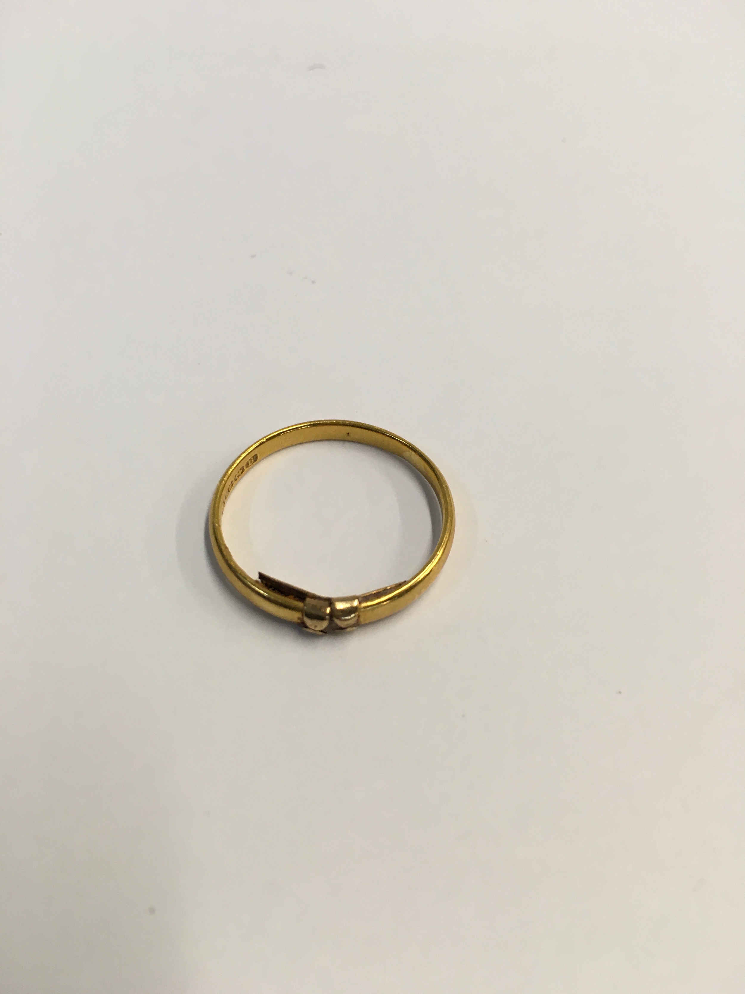 A 22ct gold wedding band. Weight 2.14g. 
