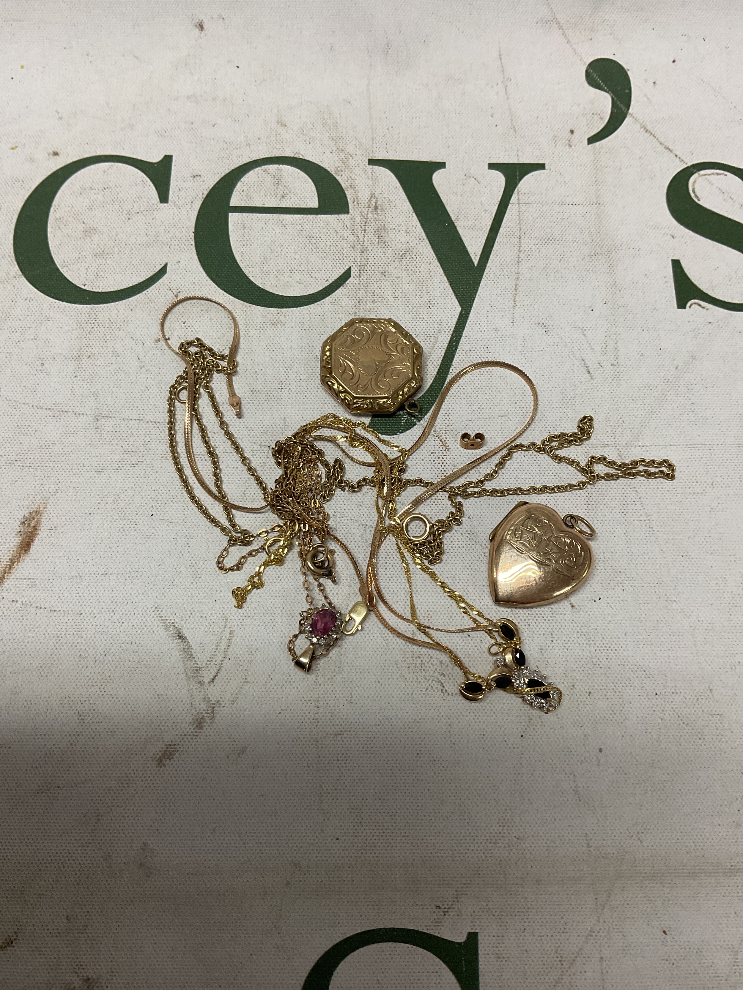 9ct chains, pendants and front and back lockets. weight 9ct 10 grams lockets 9 grams
