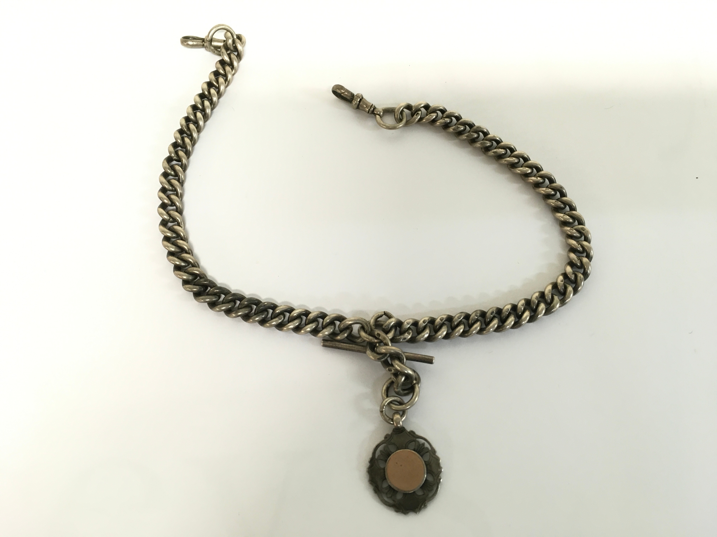 A silver watch chain. 94.20g and 42cm long.