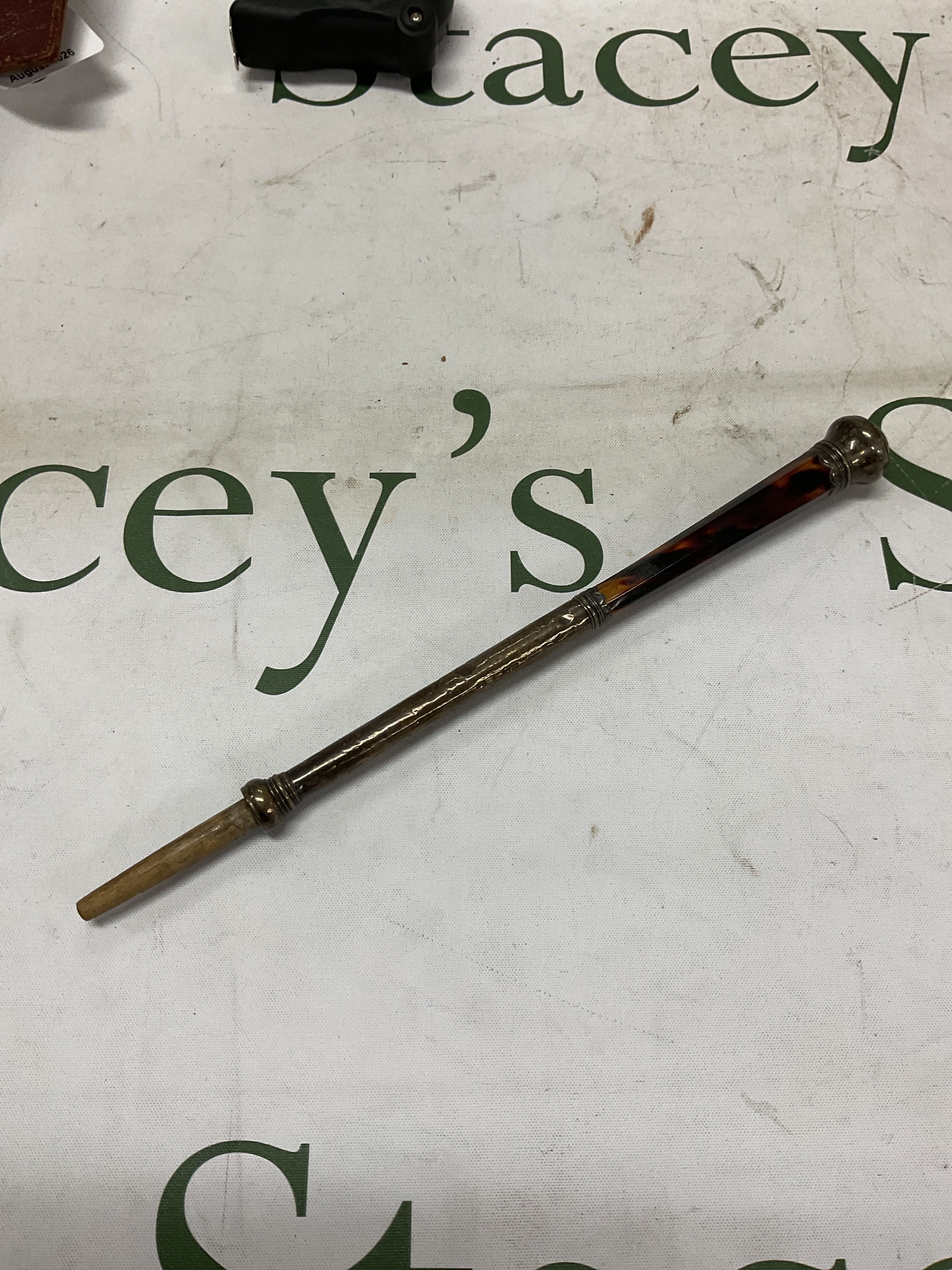 19th Tortoiseshell and white metal parasol handle. 24 cm.
