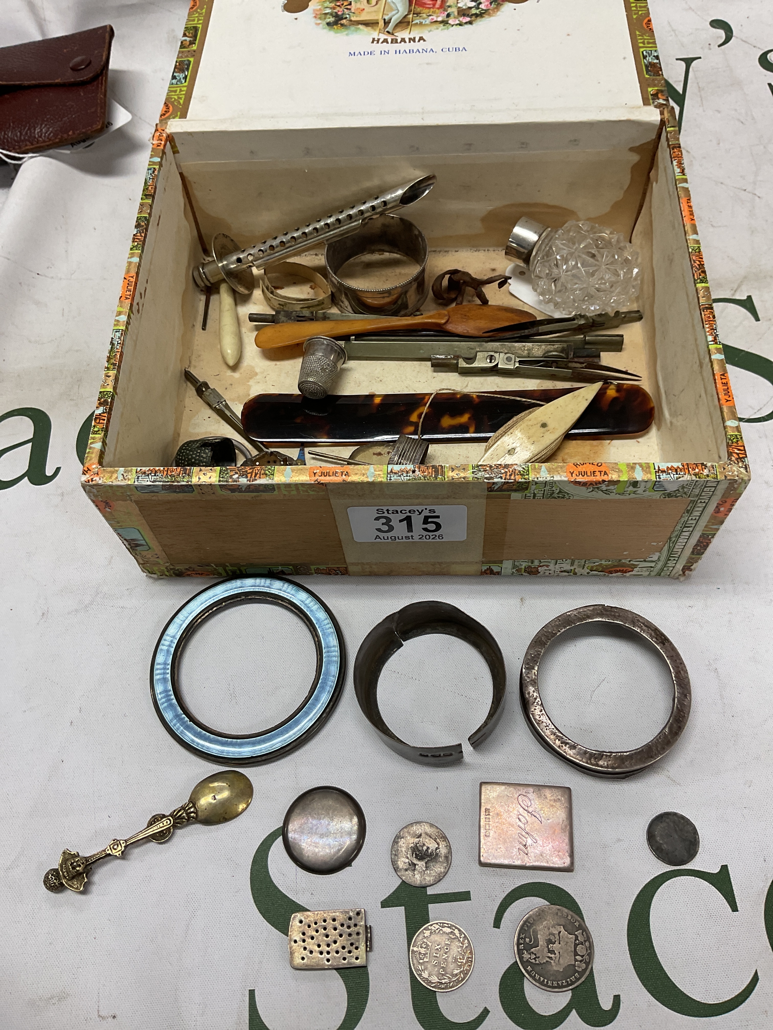 Box of silver items fittings etc, thimbles,coins, tortoiseshell page turner etc.