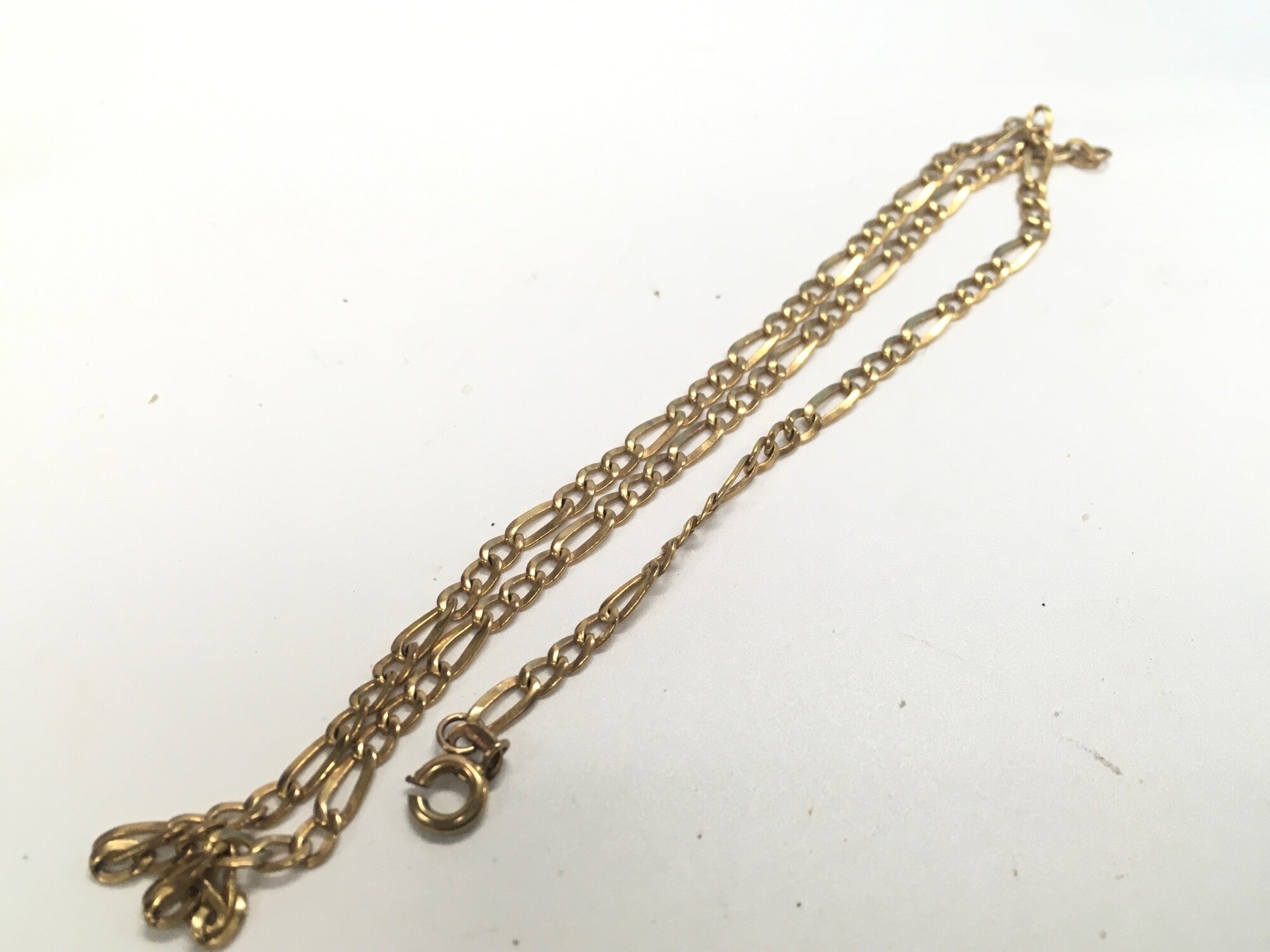 A 9ct gold figaro chain. Approx weight 5.4 grams.