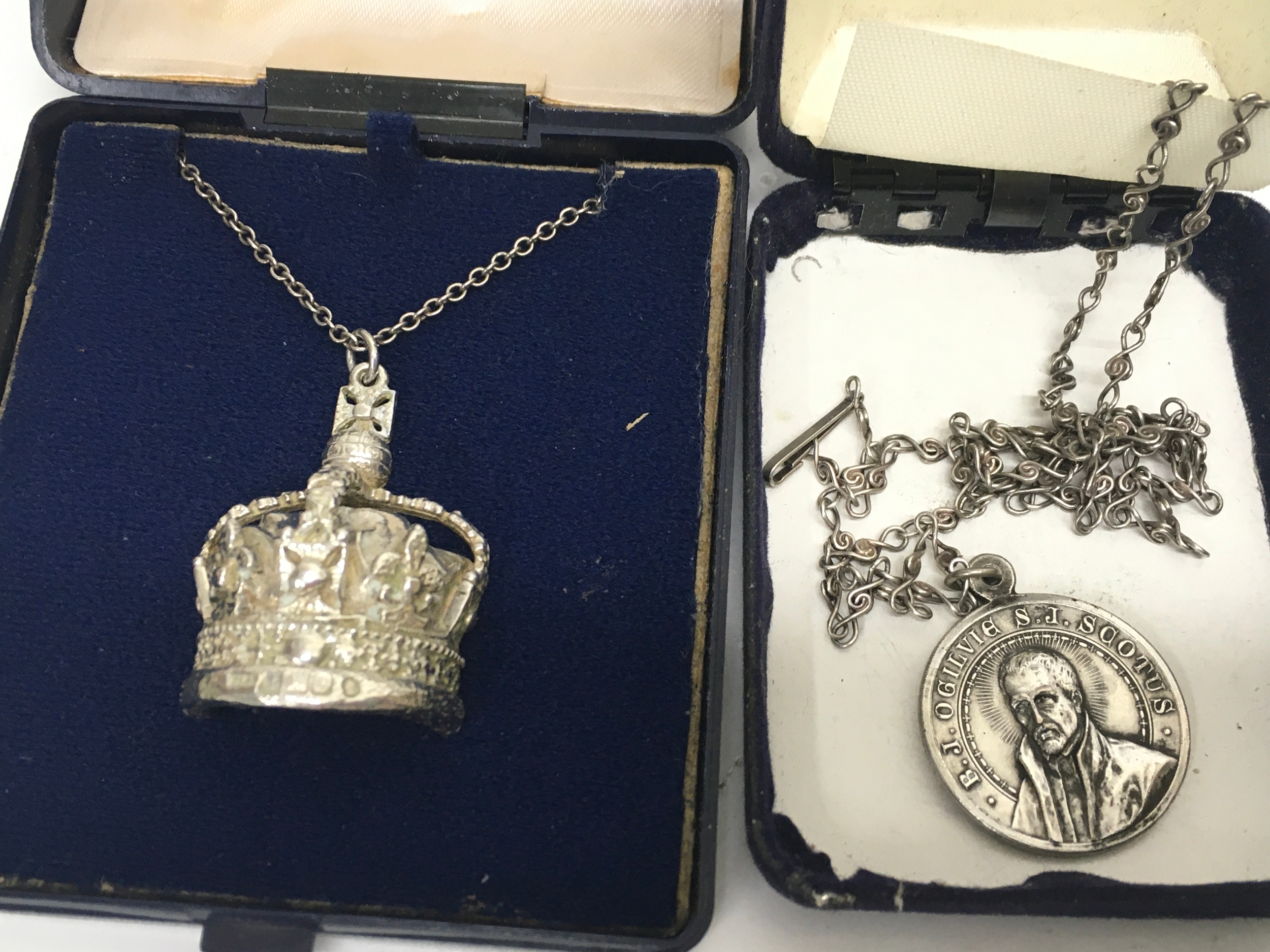 A queen jubilee crown pendant on chain and
