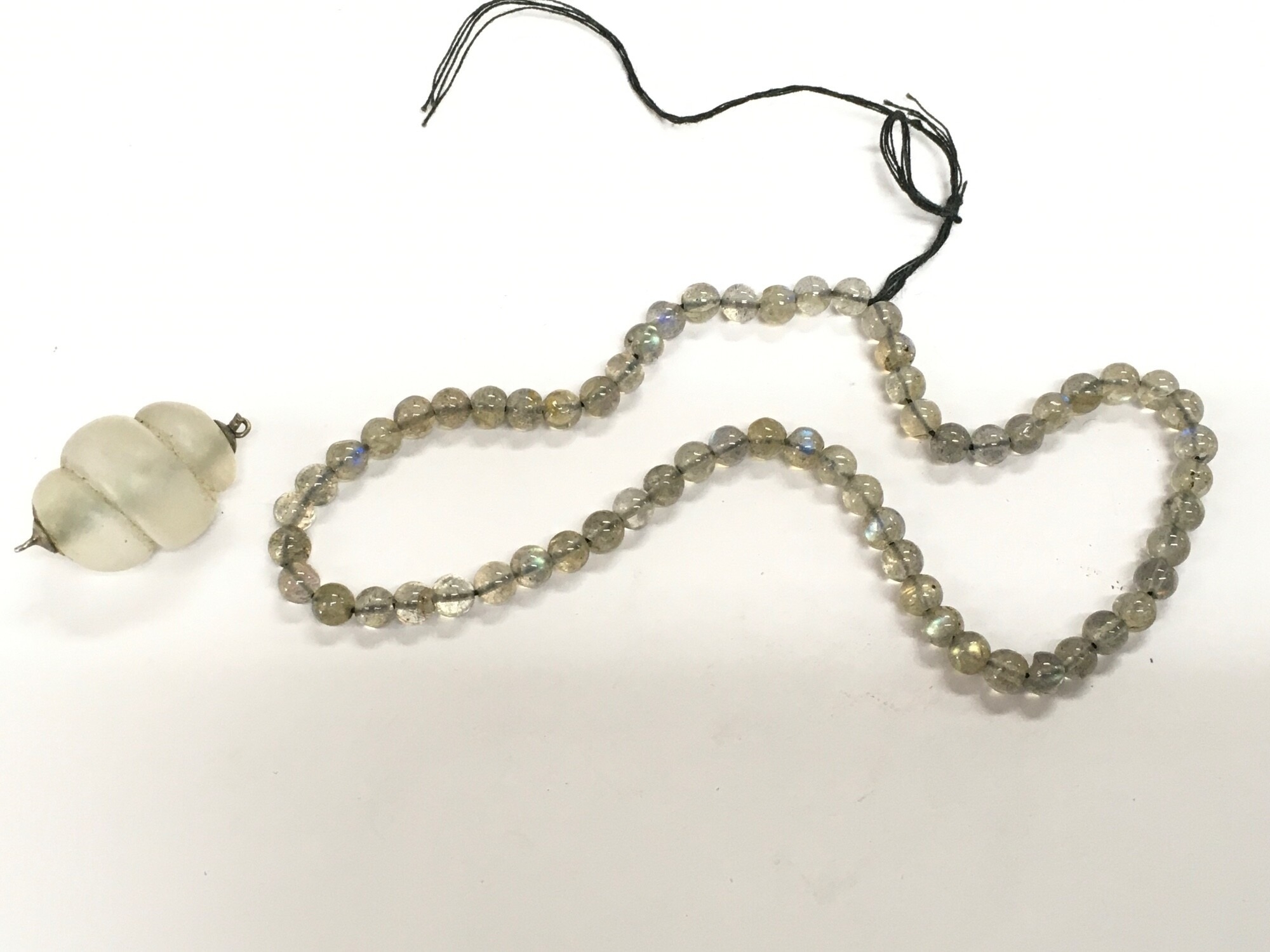 A string of water opal beads and a crystal pendant. NO RESERVE