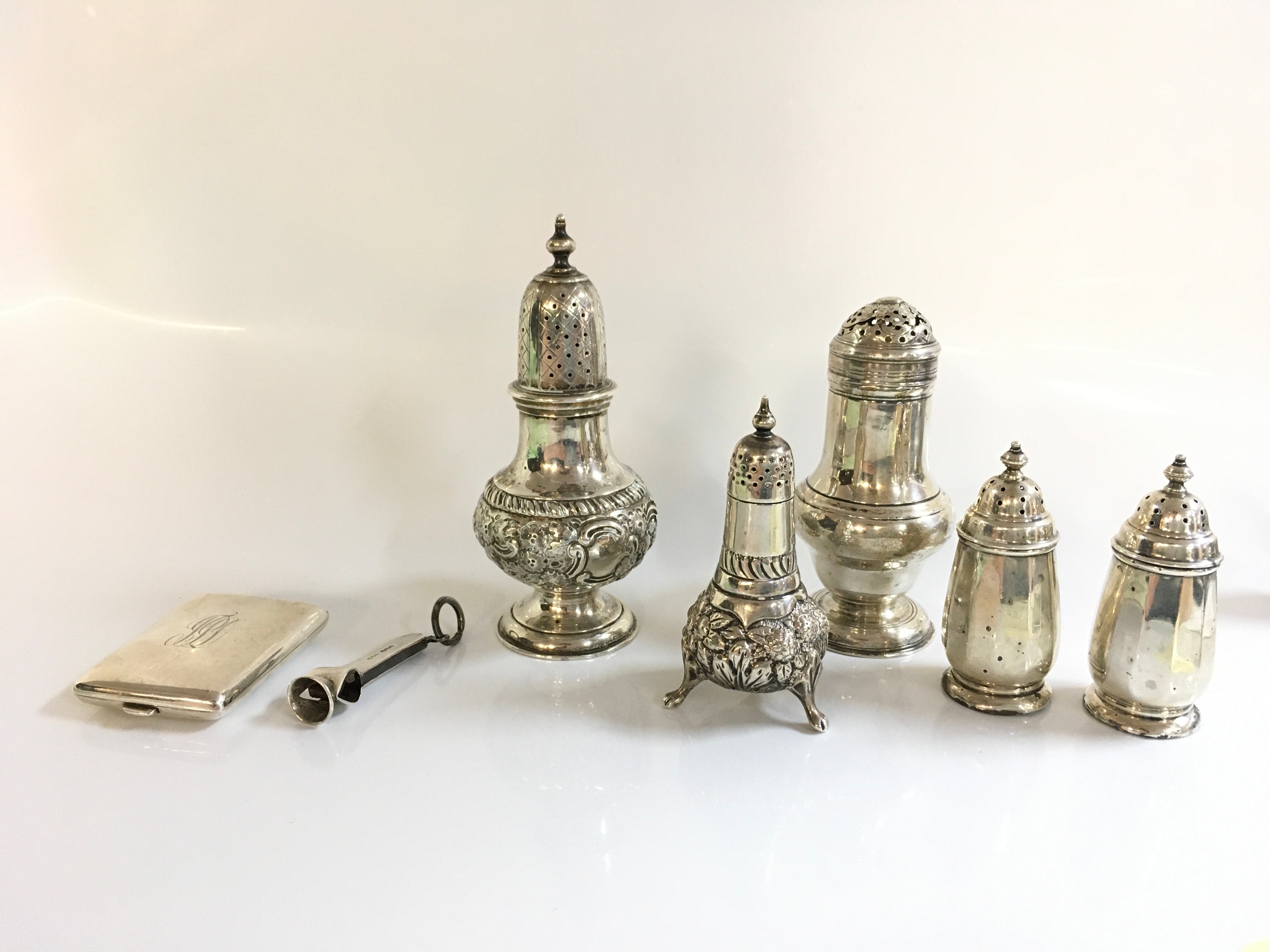 A collection of silver hallmarked items including condiments, cigar clip, match case. 330g total weight approximately