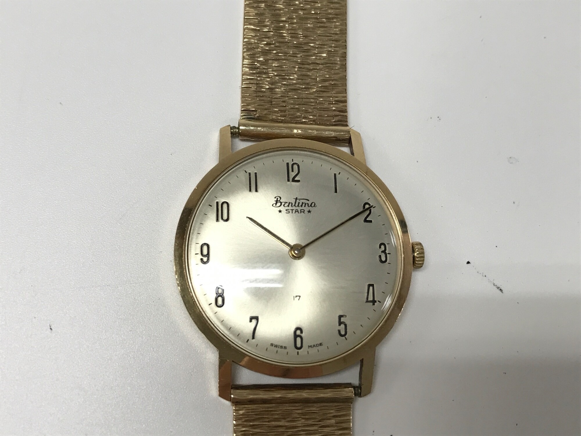 vintage 9ct gold cased Bentima Star watch silver dial with Arabic numerals and a textured 9ct gold mesh bracelet. 56.62g Winds and runs.
