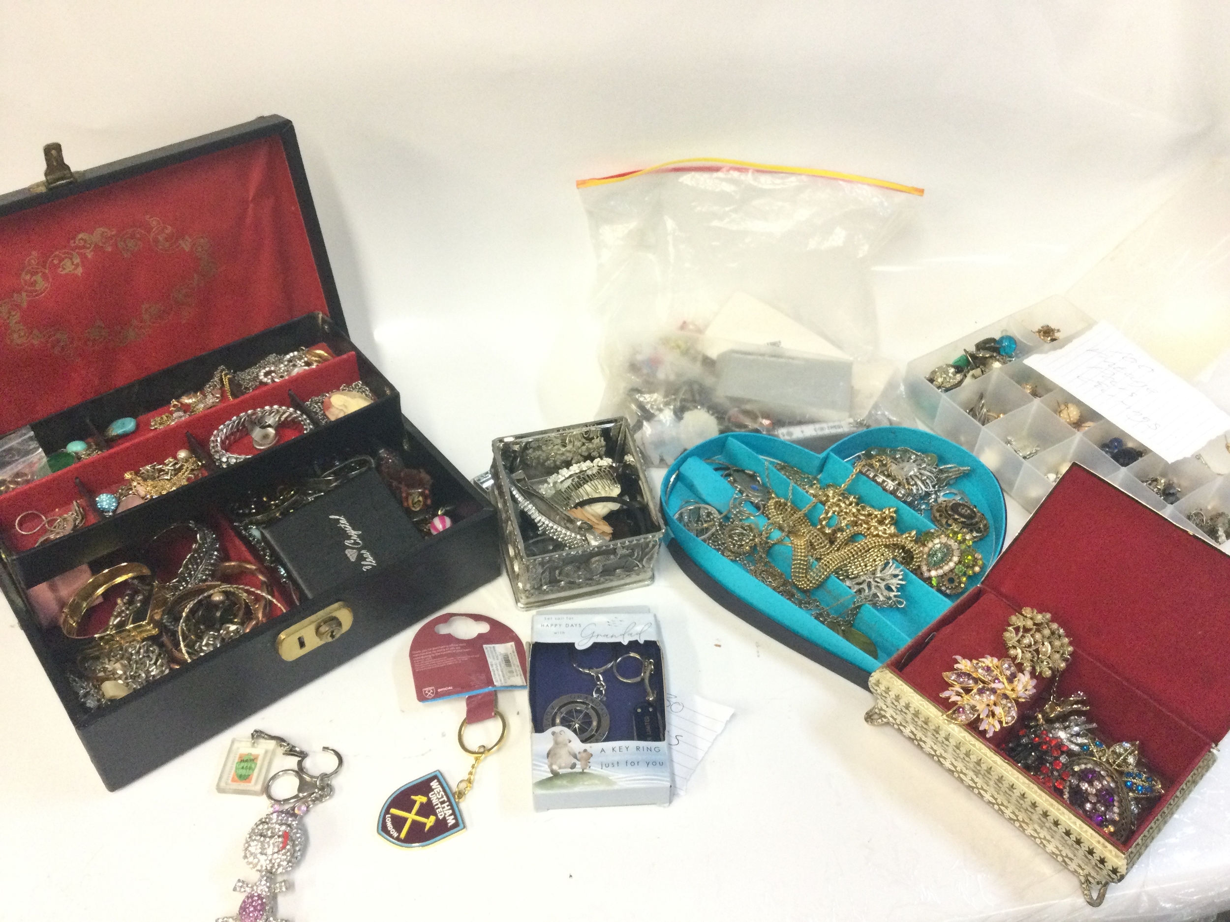 A collection of costume jewellery including necklaces, rings, key rings , brooches etc