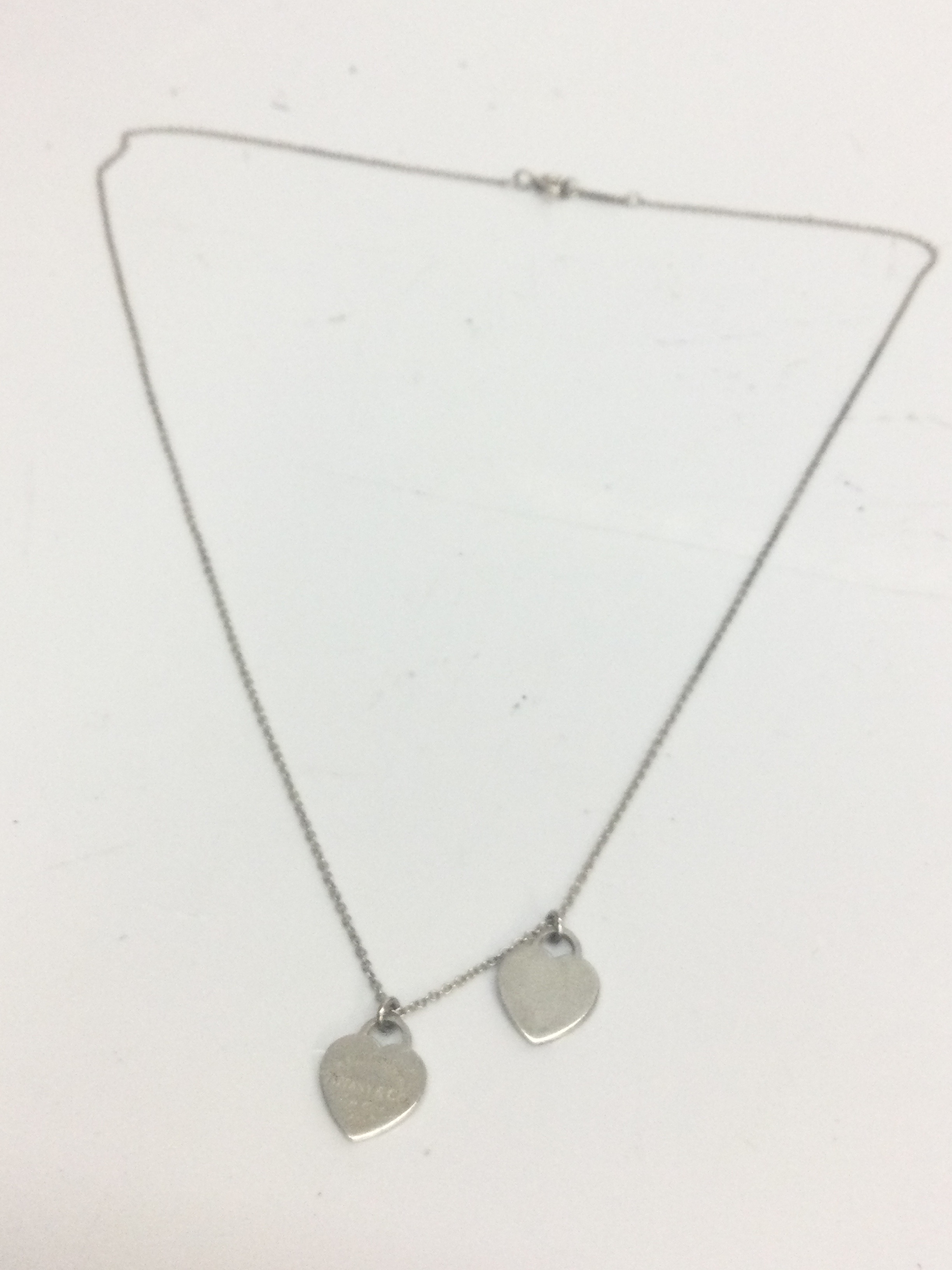 Silver Tiffany and Co necklace with double heart pendant , 2.8g 