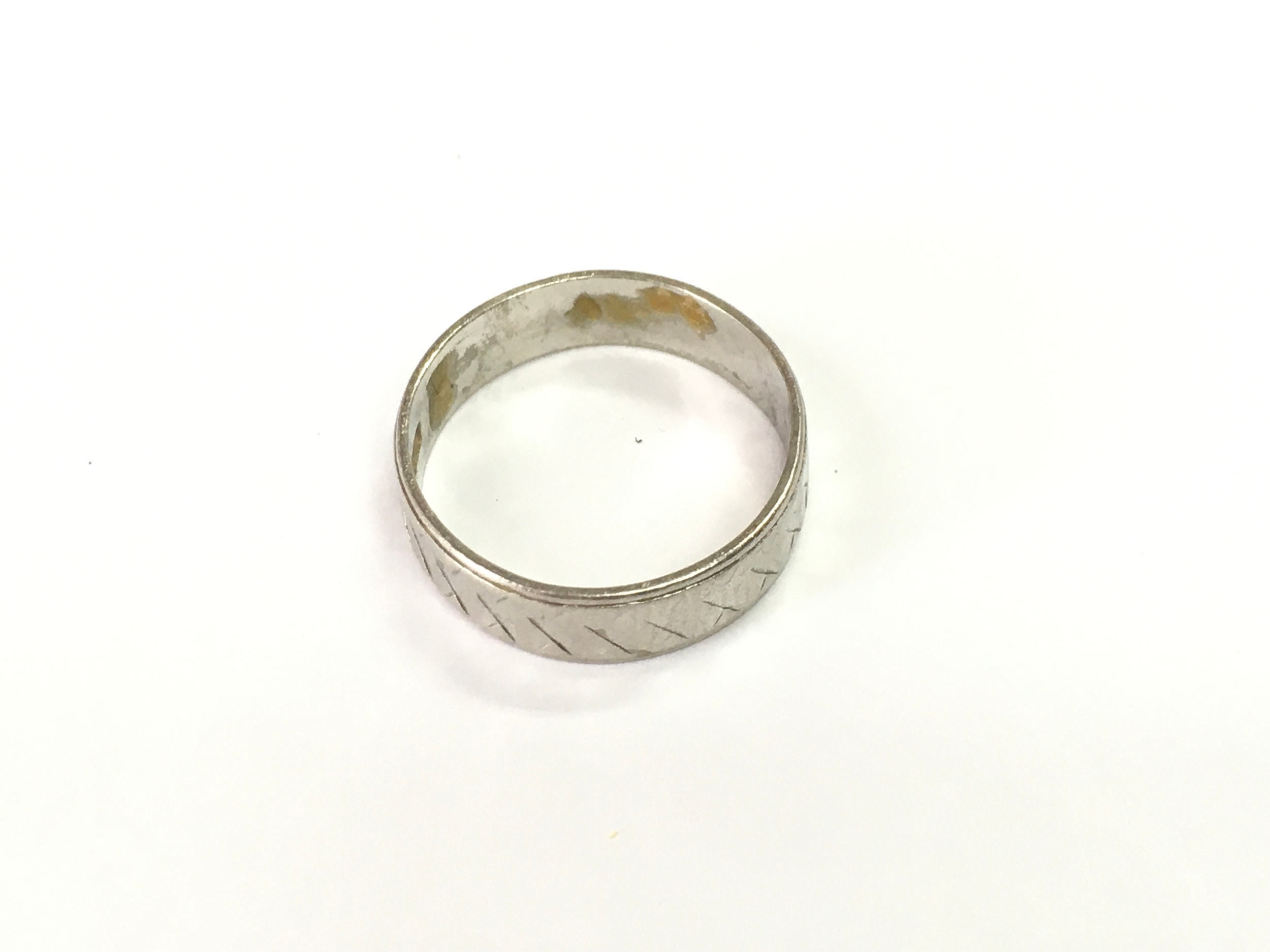A Platinum wedding band. Size M 1/2 and 4.3g