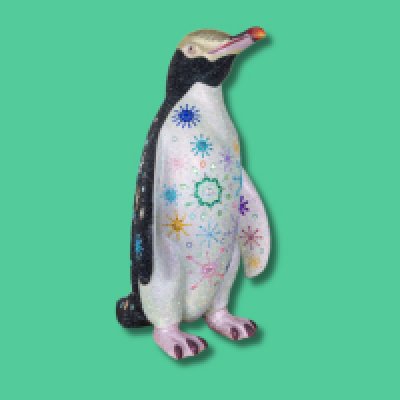 Snowflake SMALL SCULPTURE - Artist: Sarah Nash / Snowflake represents a sparkly twist on the traditional colours of a yellow eyed penguin, right down to his ruffled head feathers and gloriously pink feet. His back reflects the beauty of snowflakes on a dark wintery night. His tummy welcomes the explosion of colour in spring and summer. He's a penguin who shines in all seasons. Height - 1000mm width 600mm depth 720mm weight 18kg