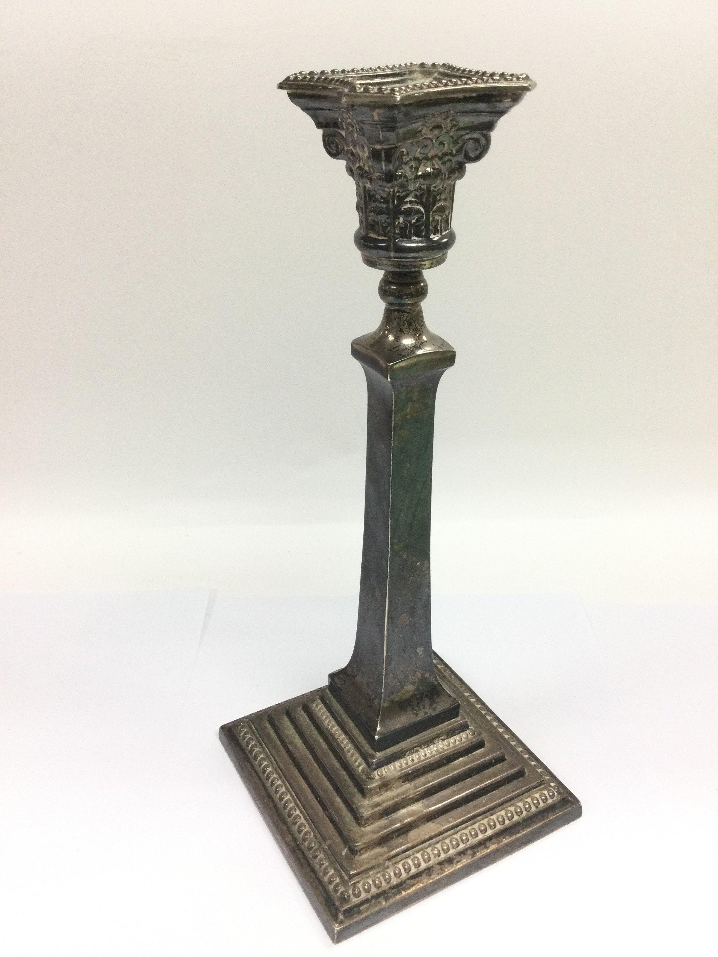 A silver candlestick, approx height 30.5cm. London hallmarks. Shipping category B.