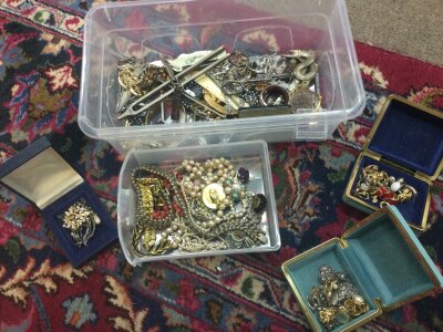 A mixed collection of costume jewellery including necklaces , brooches etc