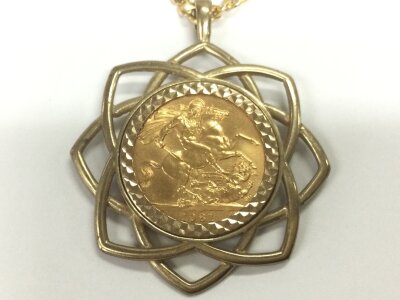 A 1981 full sovereign in gold mount and chain. 23.5g