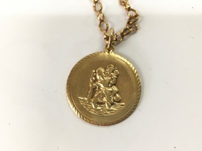 A 9ct gold st Christopher with chain. 18.17g