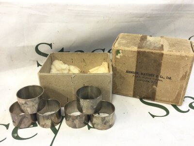 Six white metal napkin rings