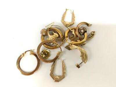A collection of assorted 9ct gold earrings and charms. 
17.38g