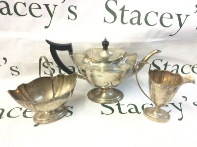 A Mappin and Webb three piece silver hallmarked tea set. 10 to 19cm tall. Sheffield 1911. 1065g total weight