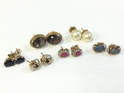 Pairs of Gold earrings set with various stones, 9.2g