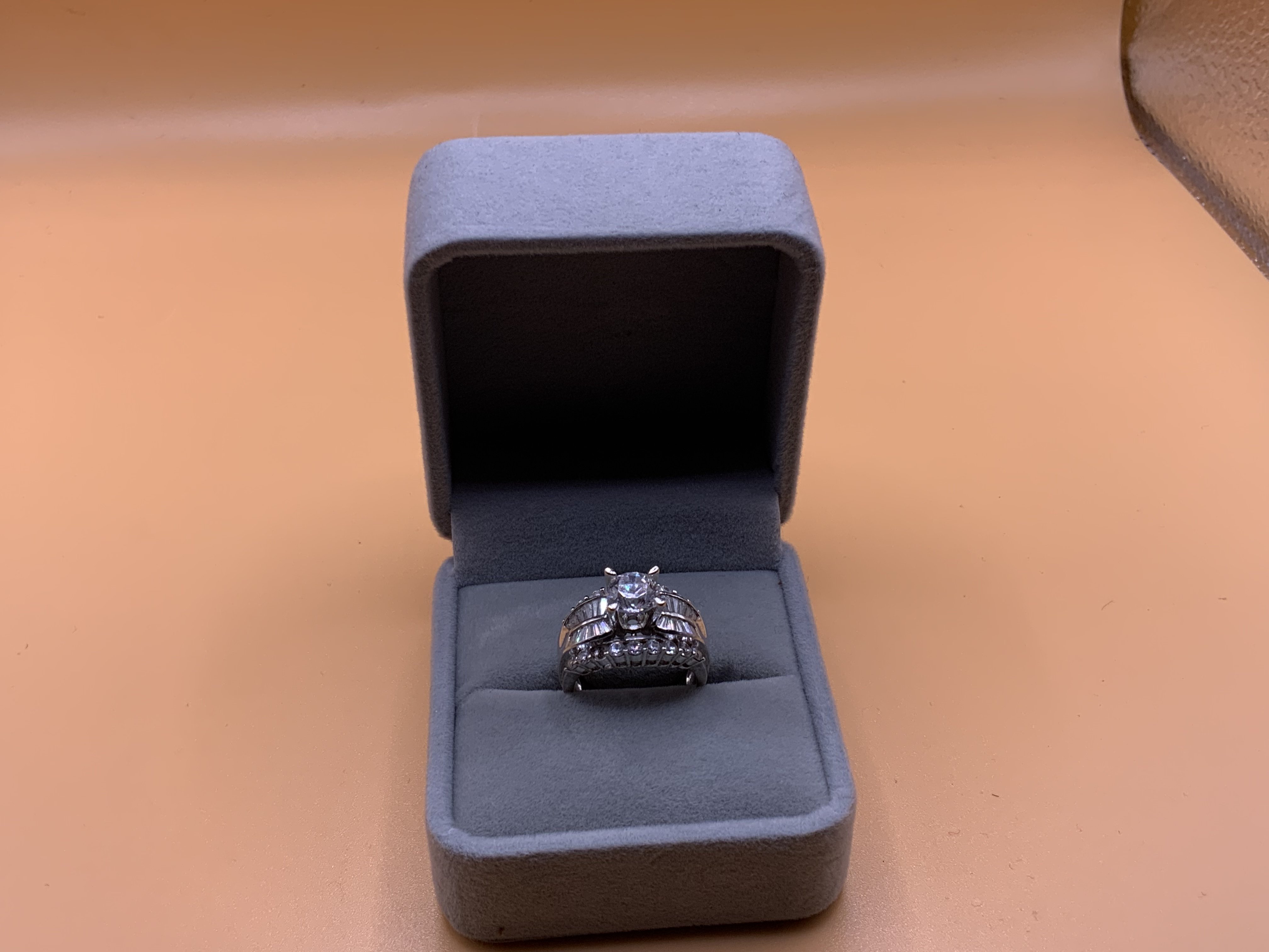 A 9ct white gold and CZ cluster ring. Size N