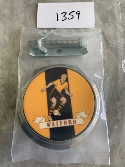 Watford 1960s Football Car Badge: Still in packaging with fixings this large heavy car badge was to be attached to the front of your car similar to RAC or AA metal badges of the day. Excellent.