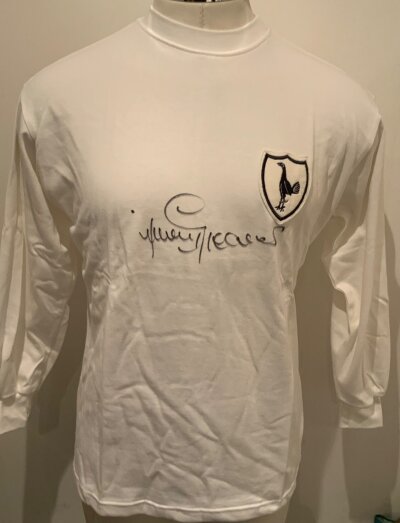 Jimmy Greaves Signed Tottenham Football Shirt: 1960s replica white home shirt clearly signed in marker pen to front. Authenticity certificate included.