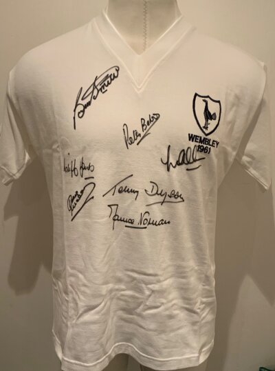 1961 Tottenham Double Season Signed Football Shirt: White replica shirt embroidered Wembley 1961 to breast below cockerel. Front is clearly signed by Smith Allen Baker Dyson Jones Norman and Mackay.