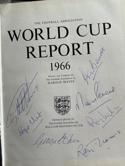 1966 World Cup Report Multi Signed Football Book: Very good condition Heinemann book without dust jacket and undedicated autographs. Signed by  7 of the 1966 World Cup Squad including Bonetti Flowers Cohen Hurst Wilson Peters and Hunt.